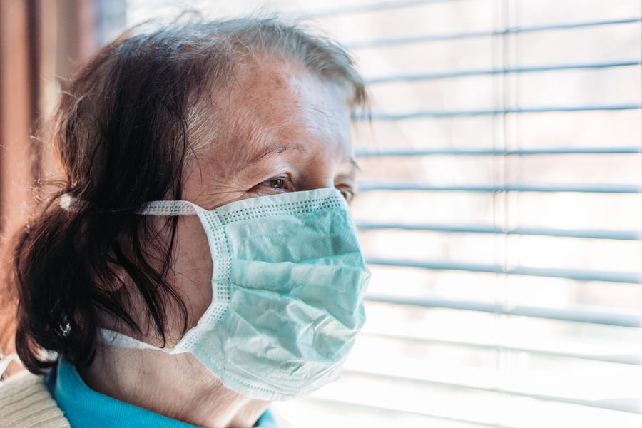 Elderly woman with dementia wearing face mask