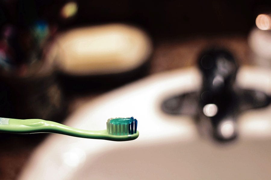oarl care in elderly, toothbrush with toothpaste