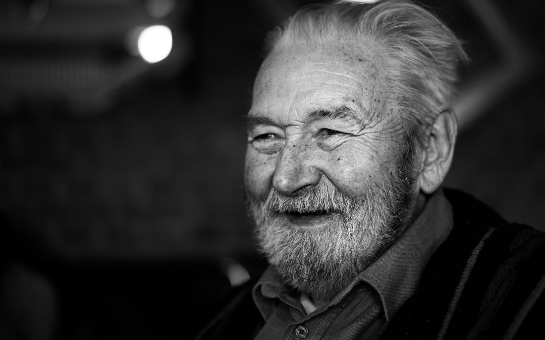 independence concept - elderly man smiling in black and white