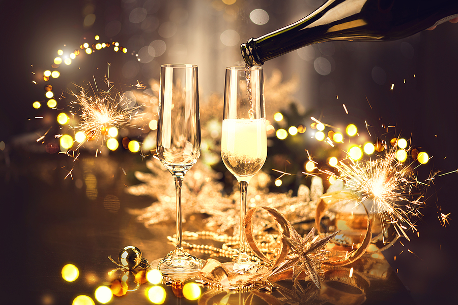 new year celebration champagne and bokeh lights