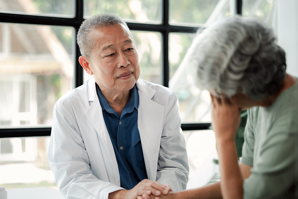 doctor performing mental health screening for older woman