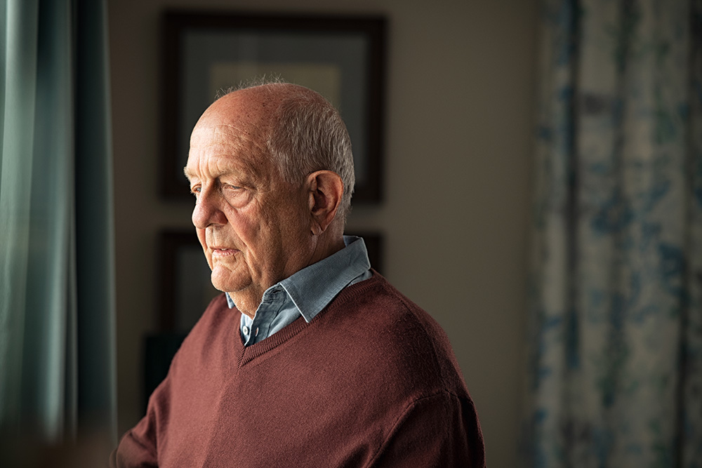 older man looking forlorn - caring for a surviving spouse